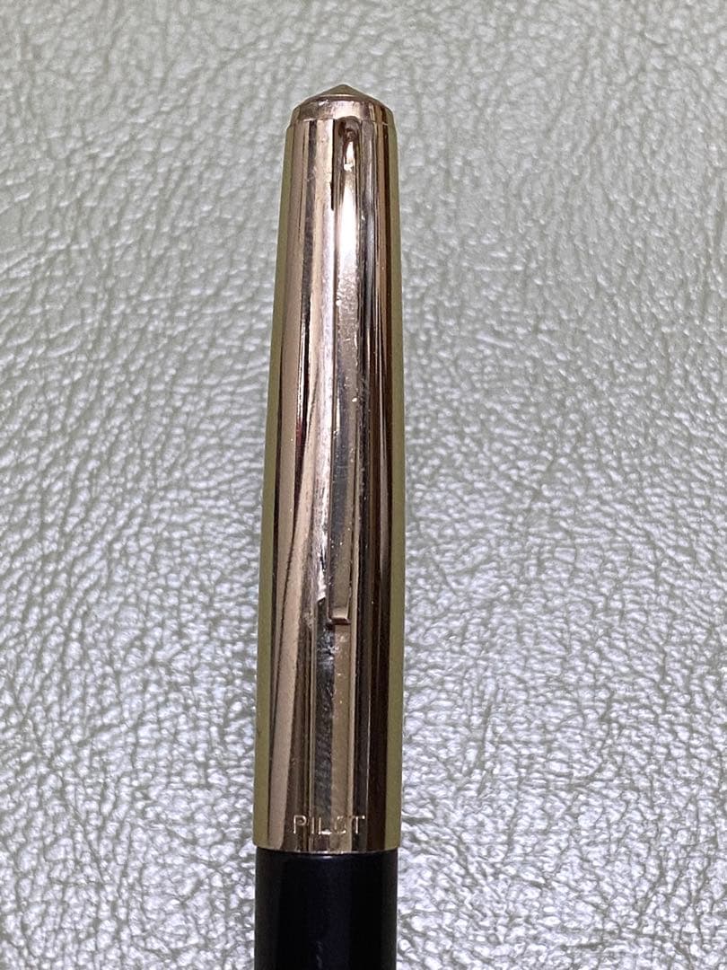 Pilot 14k Fountain Pen in gold finish showcasing nib and cap for premium writing