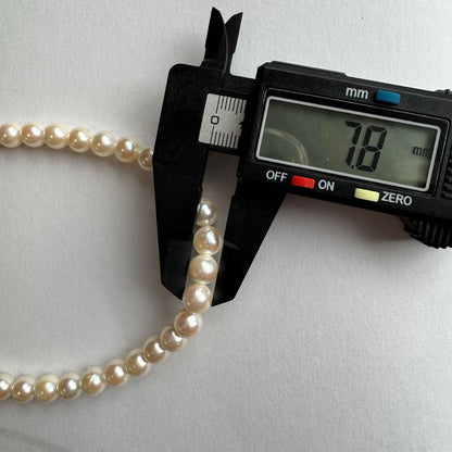 Akoya pearl necklace featuring approximately 7.8mm large white-based pearls