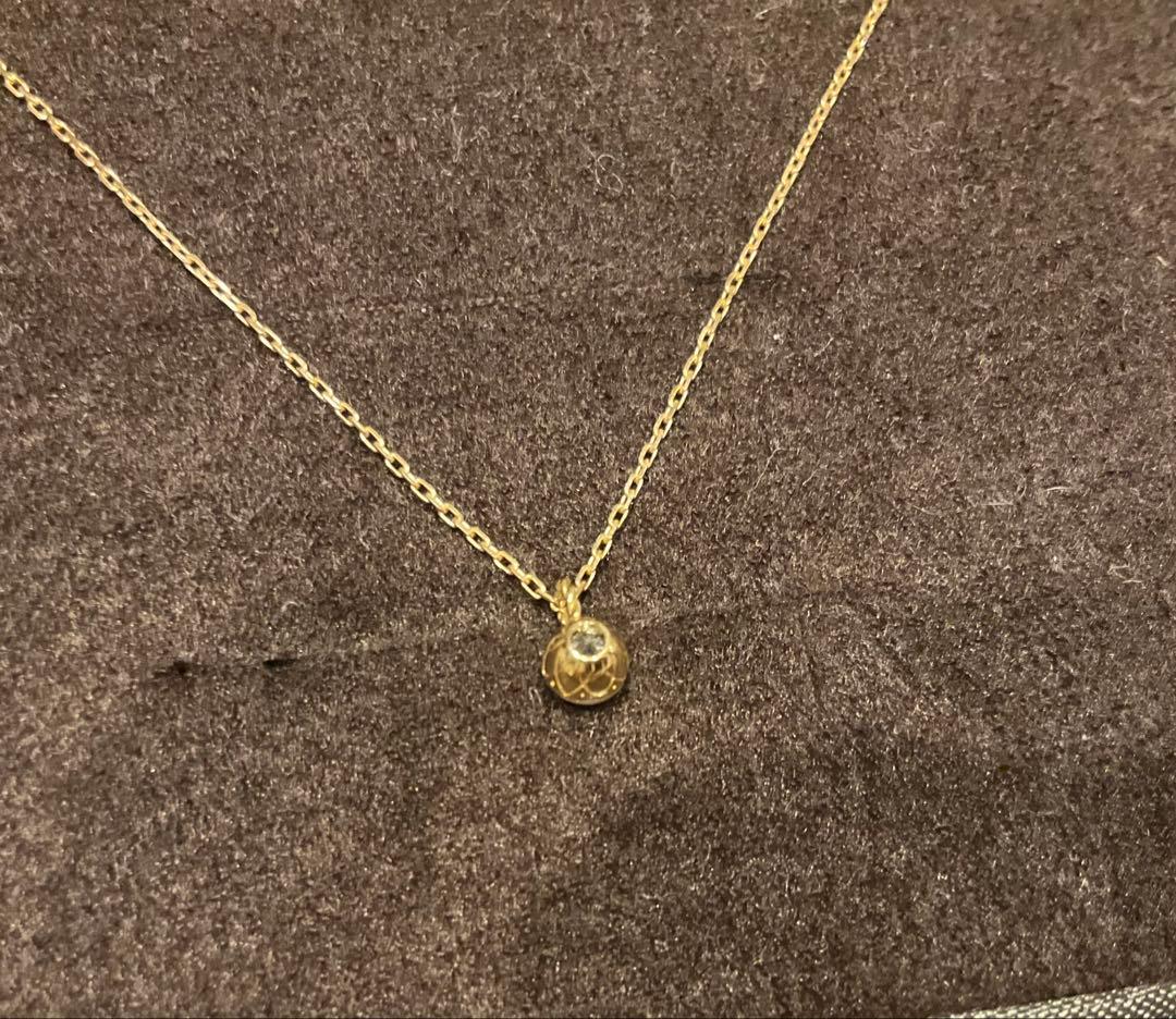 Agete K18 gold necklace featuring a 0.2ct secret cut diamond pendant