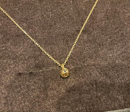 Agete K18 gold necklace featuring a 0.2ct secret cut diamond pendant