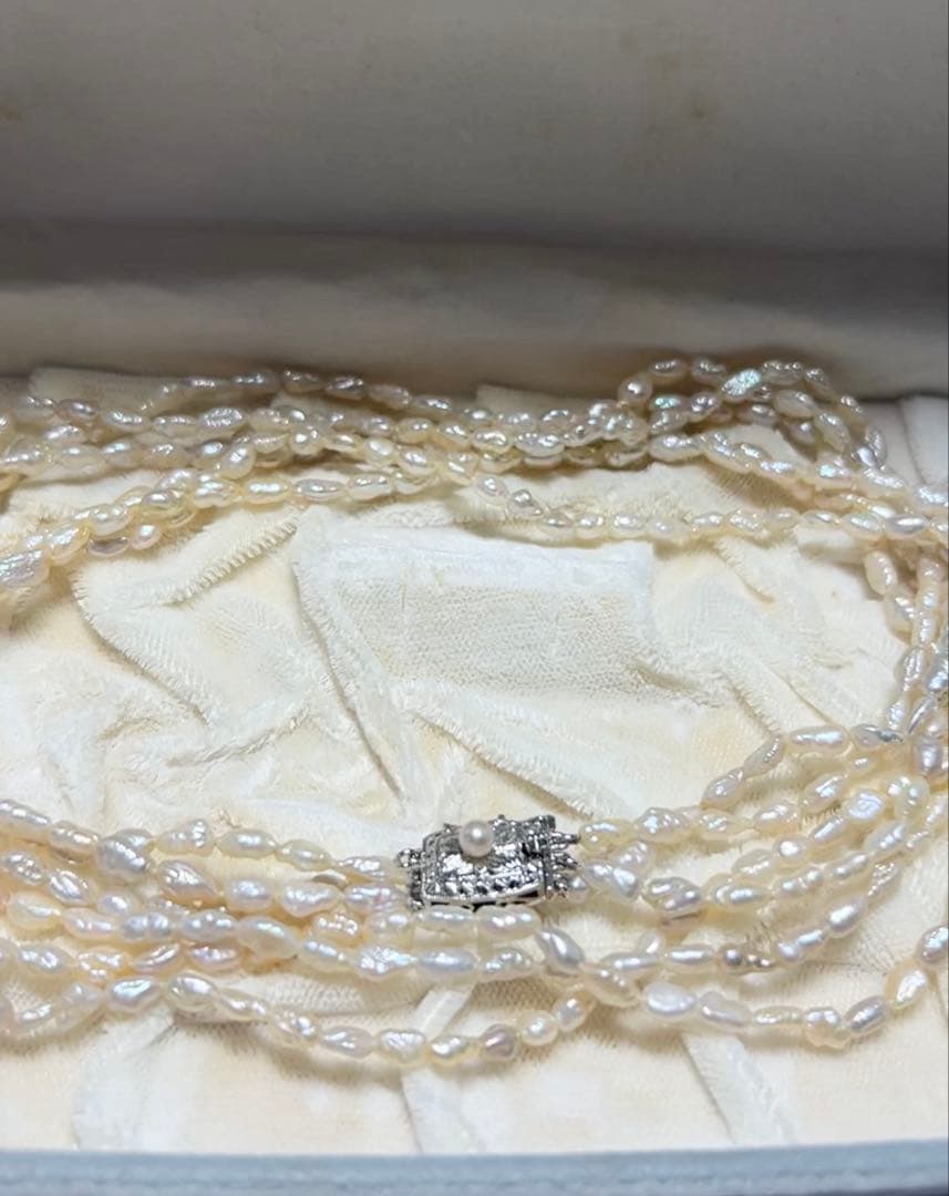 Tasaki genuine pearl necklace 66 cm length elegant round pearls on white background