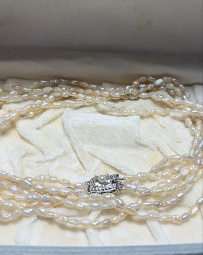 Tasaki genuine pearl necklace 66 cm length elegant round pearls on white background