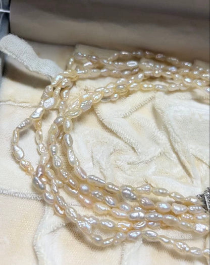 Tasaki genuine pearl necklace 66 cm length elegant round pearls on white background