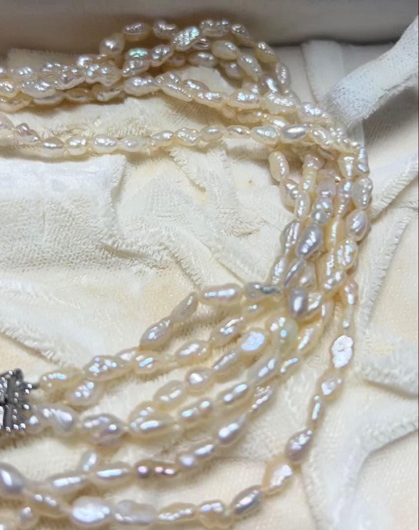 Tasaki genuine pearl necklace 66 cm length elegant round pearls on white background
