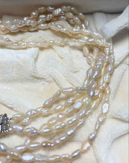 Tasaki genuine pearl necklace 66 cm length elegant round pearls on white background