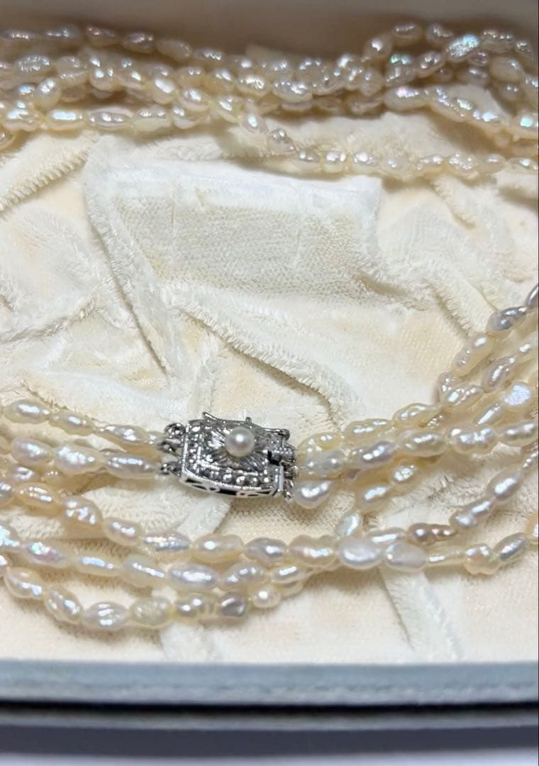 Tasaki genuine pearl necklace 66 cm length elegant round pearls on white background