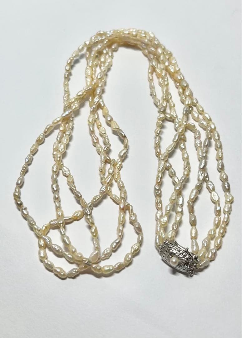 Tasaki genuine pearl necklace 66 cm length elegant round pearls on white background