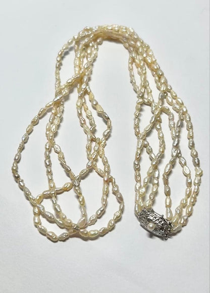 Tasaki genuine pearl necklace 66 cm length elegant round pearls on white background