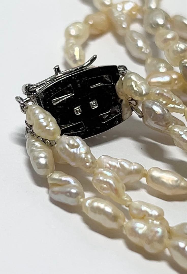 Tasaki genuine pearl necklace 66 cm length elegant round pearls on white background