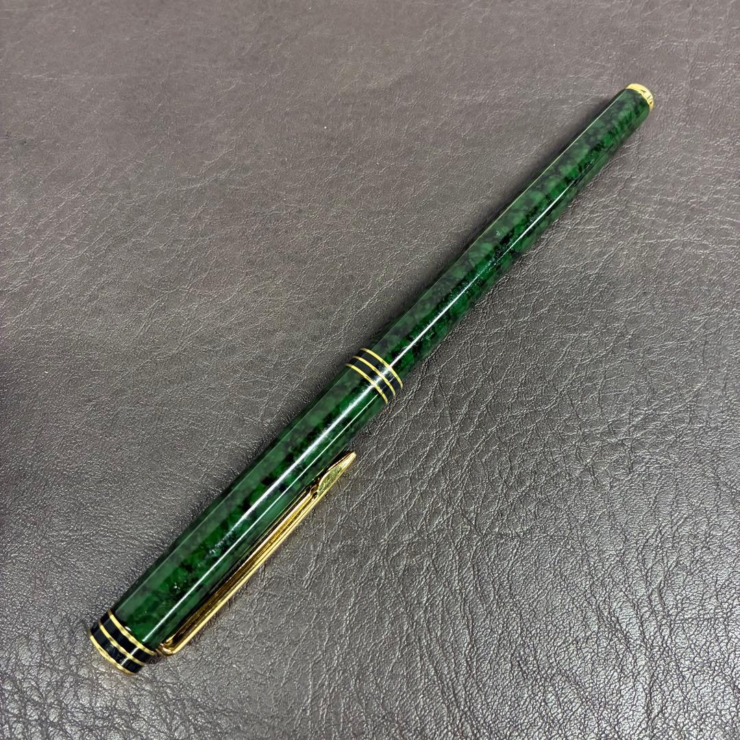 Waterman Exclusive Ballpoint Pen with green marble body, gold trim, and black textured grip