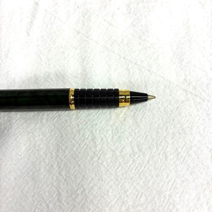 Waterman Exclusive Ballpoint Pen with green marble body, gold trim, and black textured grip