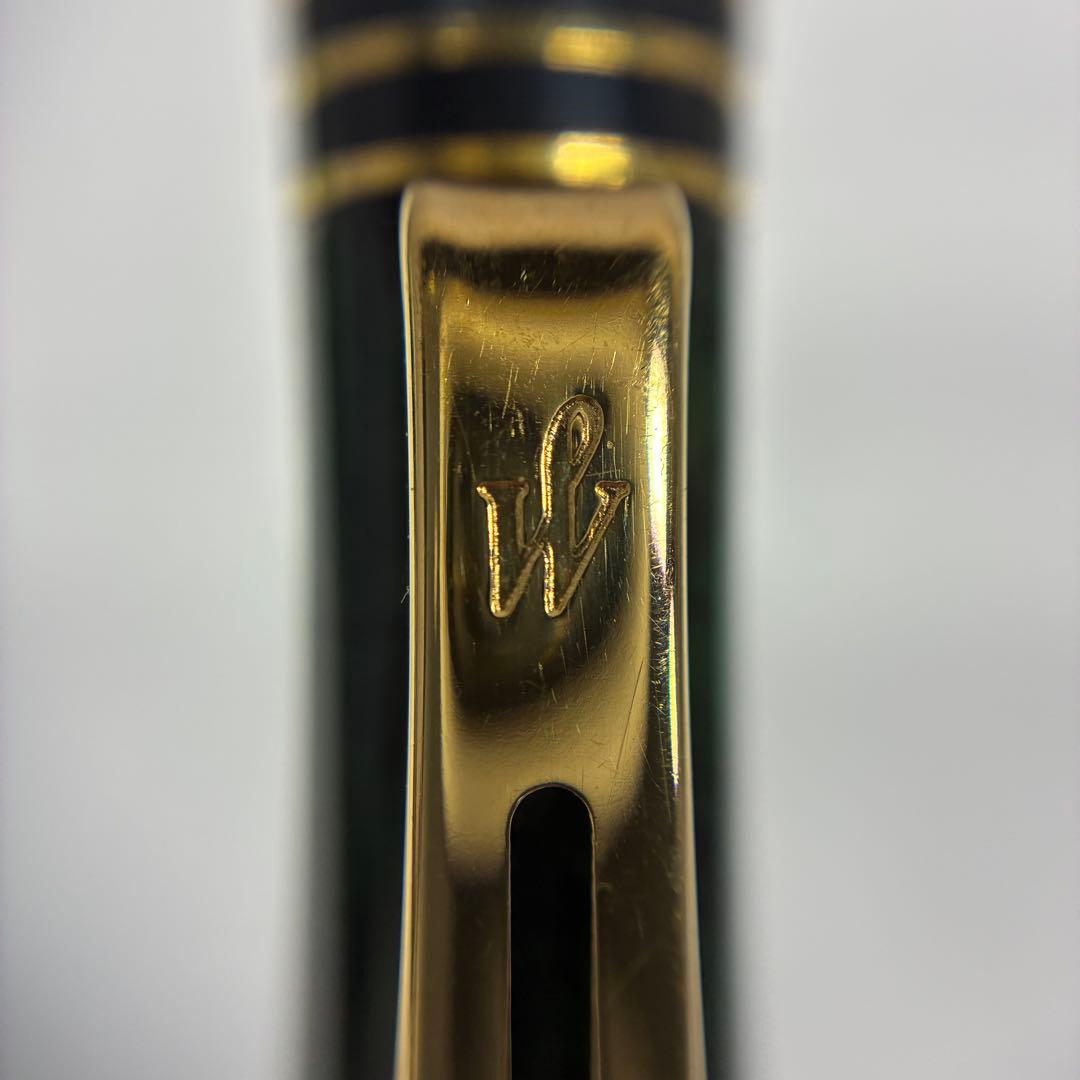 Waterman Exclusive Ballpoint Pen with green marble body, gold trim, and black textured grip