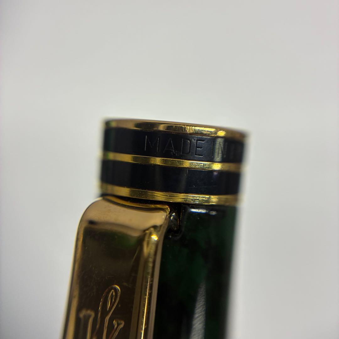 Waterman Exclusive Ballpoint Pen with green marble body, gold trim, and black textured grip