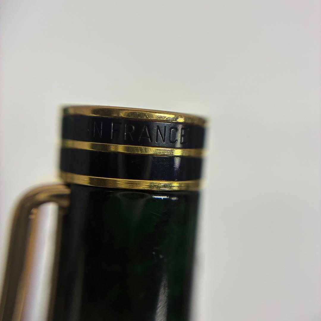 Waterman Exclusive Ballpoint Pen with green marble body, gold trim, and black textured grip