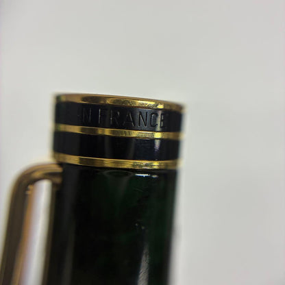 Waterman Exclusive Ballpoint Pen with green marble body, gold trim, and black textured grip