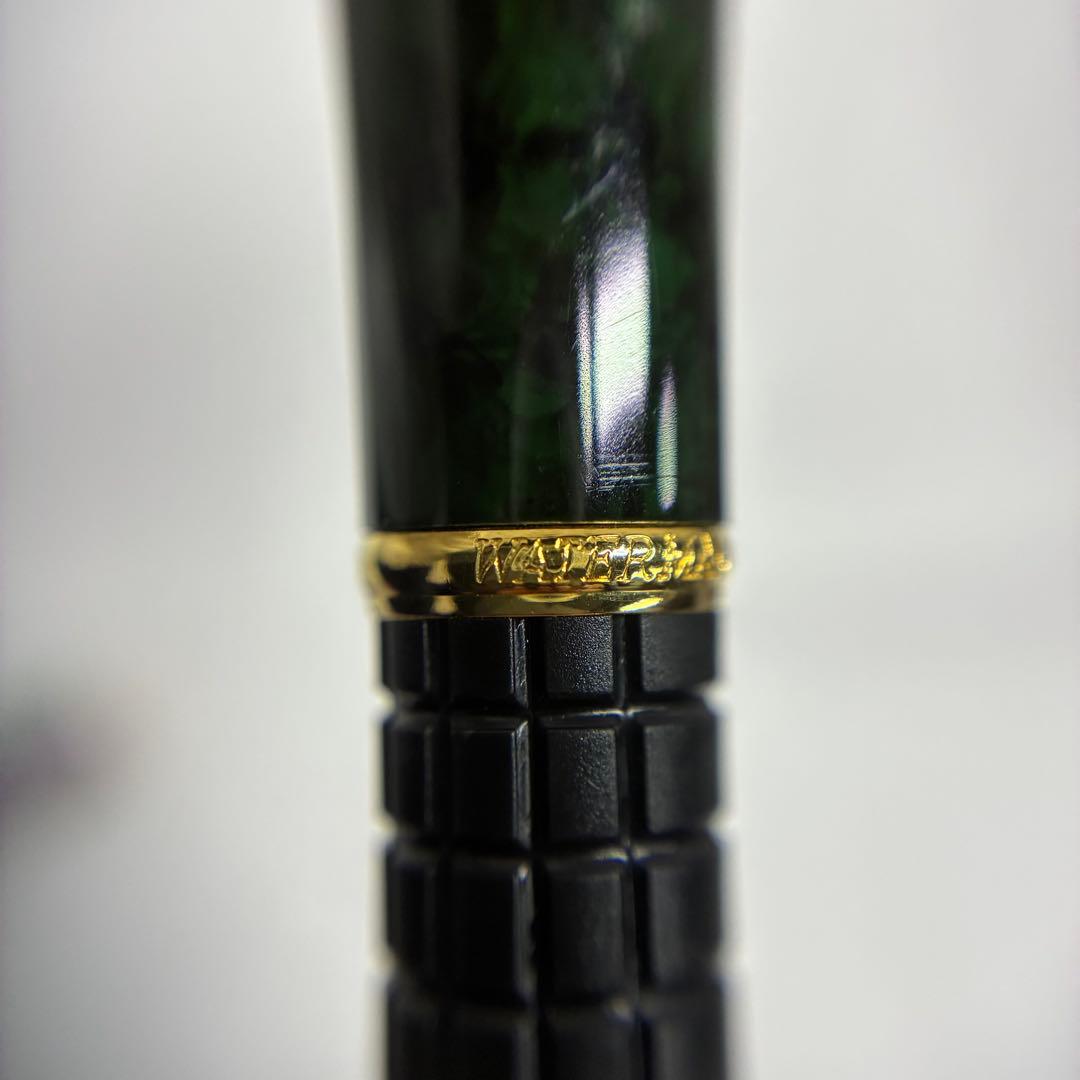 Waterman Exclusive Ballpoint Pen with green marble body, gold trim, and black textured grip
