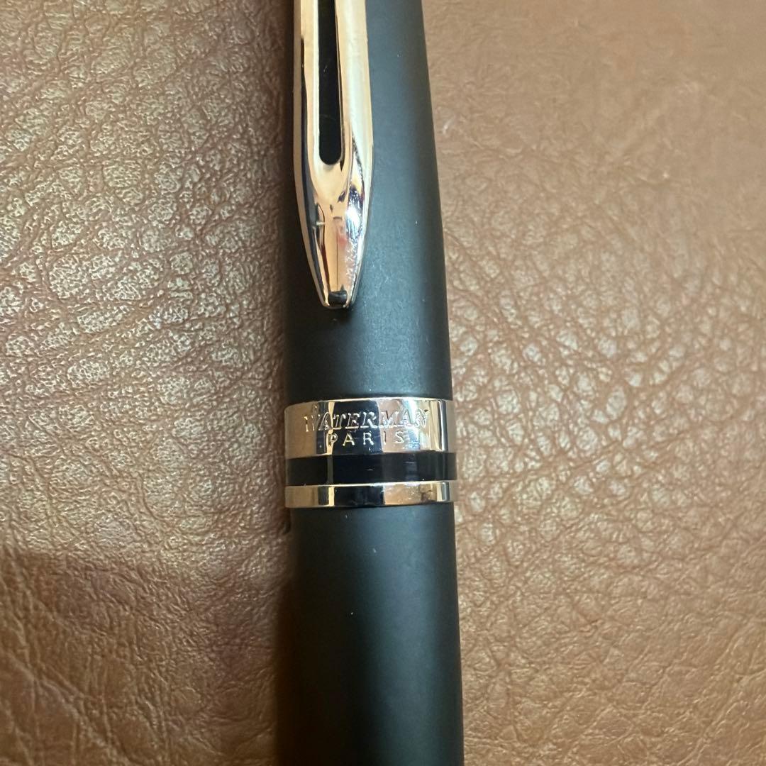 WATERMAN Expert Matte Black ballpoint pen with metal body and leather grip shown with included case
