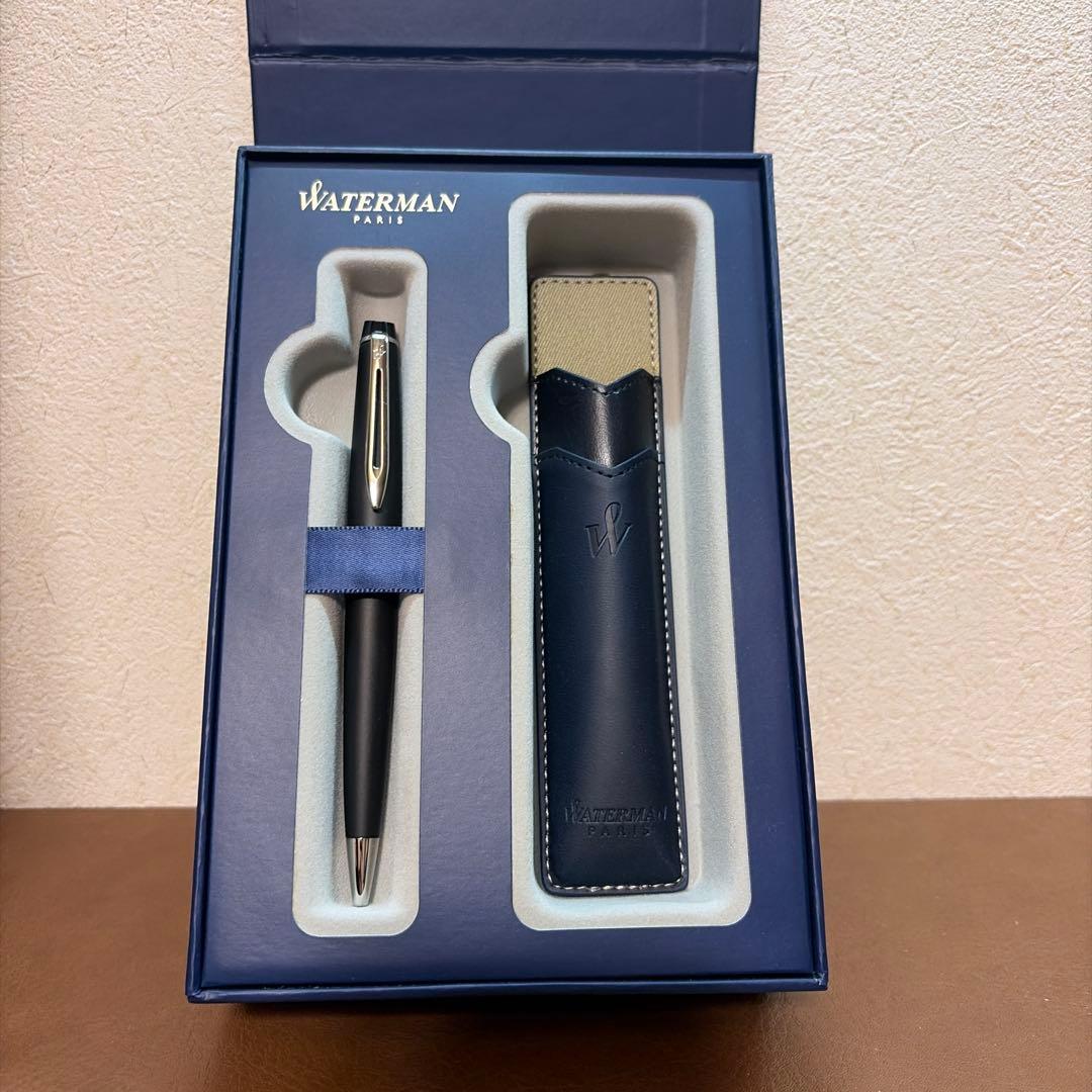 WATERMAN Expert Matte Black ballpoint pen with metal body and leather grip shown with included case