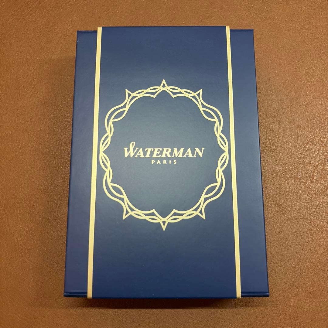 WATERMAN Expert Matte Black ballpoint pen with metal body and leather grip shown with included case