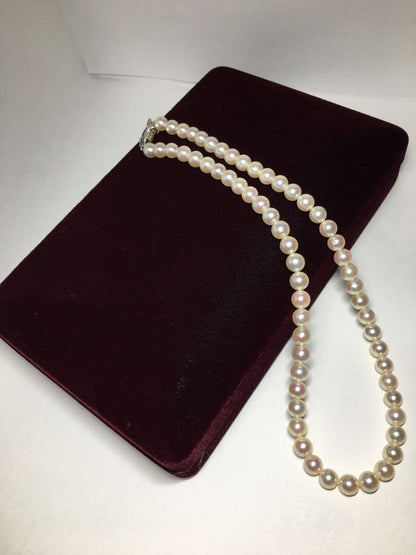 TASAKI Akoya pearl necklace 6.5-6.9mm pearls with SV clasp displayed on a white background