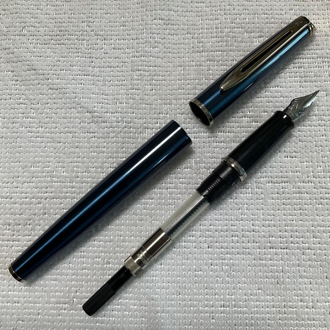 WATERMAN fountain pen with converter and black pen case holding three writing instruments