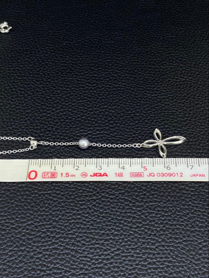 Tasaki Pearl Y-shape Cross Necklace in silver and white with a 41 cm chain on a white background