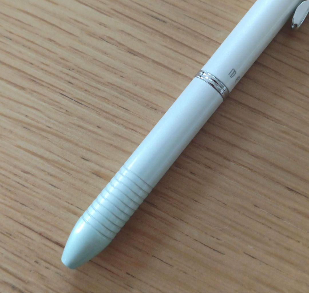 Pilot Melty 2+1 multi-function swing-type pen with black and red ballpoint tips and green 0.5mm mechanical pencil barrel