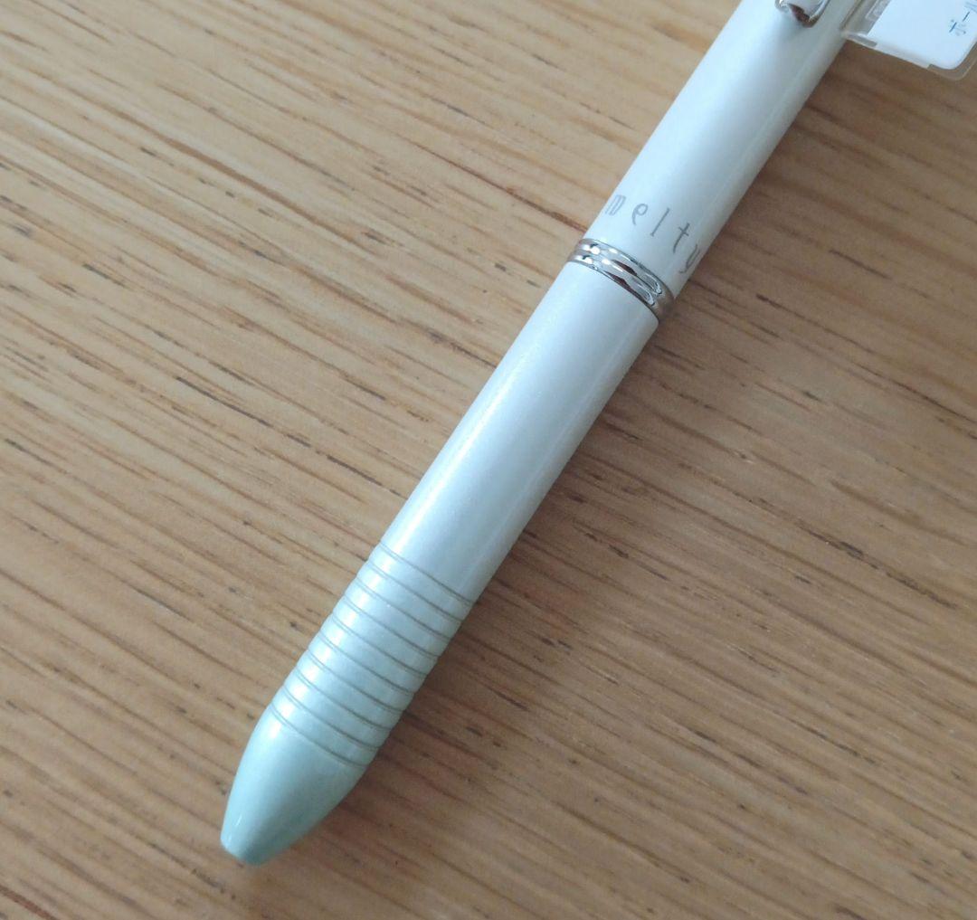 Pilot Melty 2+1 multi-function swing-type pen with black and red ballpoint tips and green 0.5mm mechanical pencil barrel