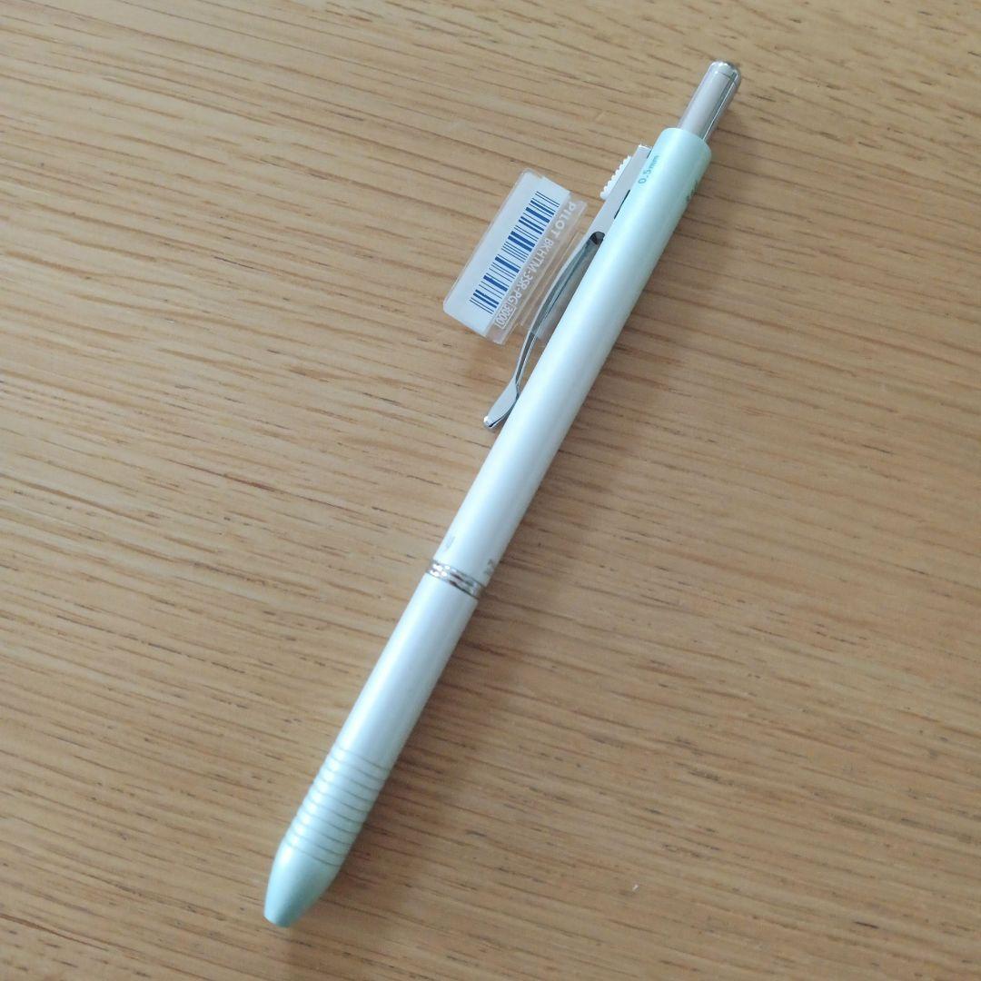 Pilot Melty 2+1 multi-function swing-type pen with black and red ballpoint tips and green 0.5mm mechanical pencil barrel