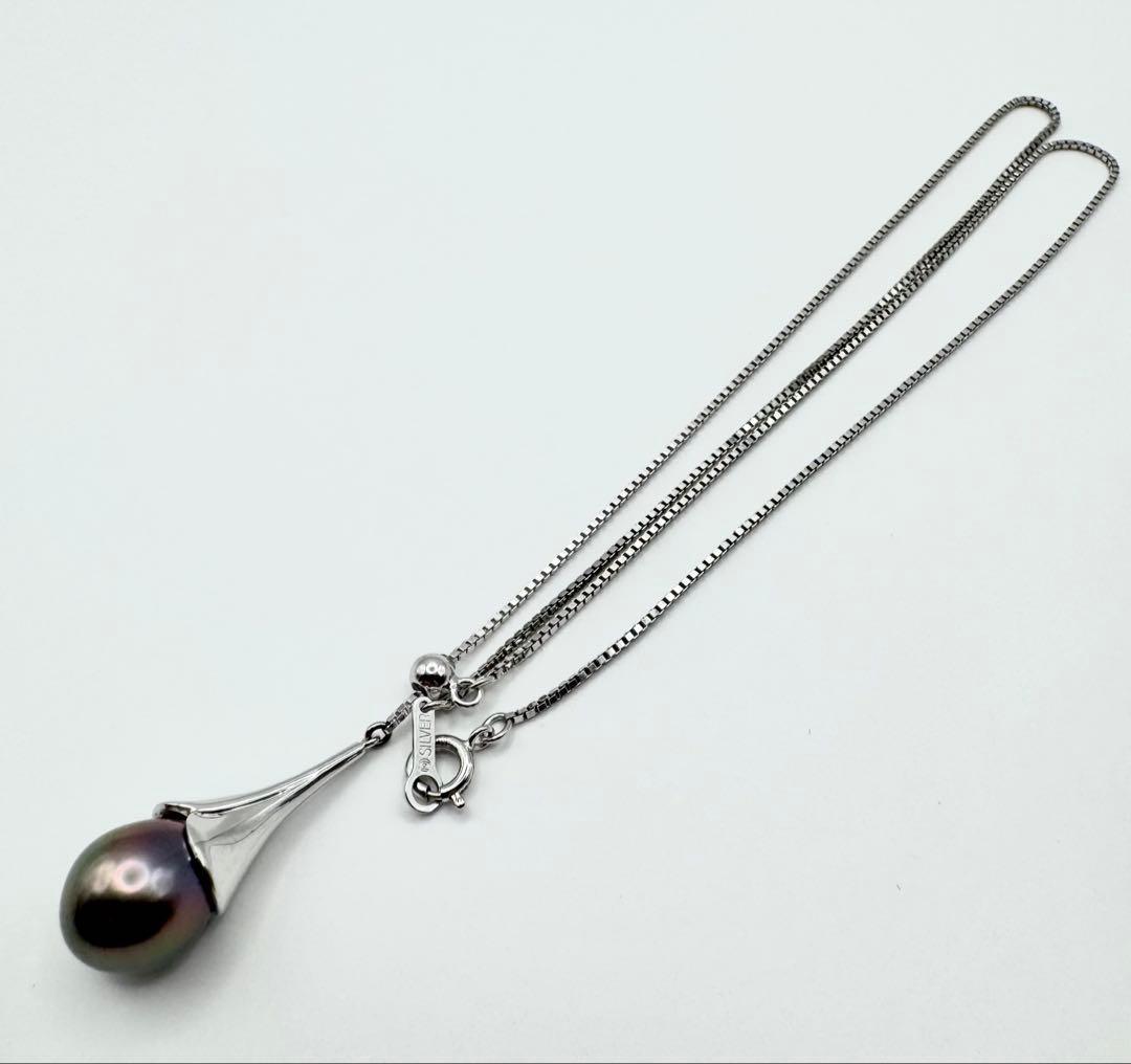 Tasaki SV Black Bird of Paradise necklace featuring a 10.8mm peacock color pearl on a 45cm chain