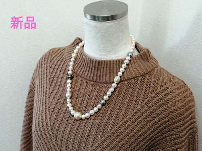 Law necklace featuring 9.5-9 mm South Sea white and Tahitian black baroque pearls on a 54 cm strand