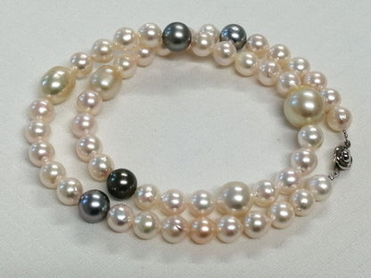 Law necklace featuring 9.5-9 mm South Sea white and Tahitian black baroque pearls on a 54 cm strand