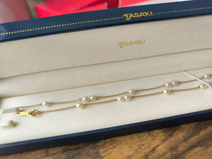 Tasaki K18 gold station necklace with white pearls on a 39 cm chain displayed on a white background