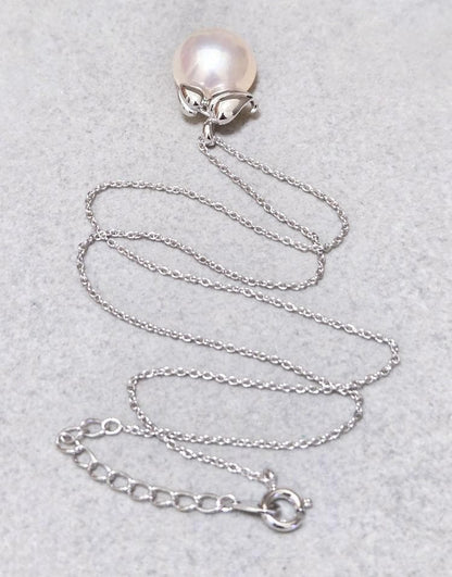 Tasaki Pearl Mabe Pearl silver necklace with a 42cm chain and detailed top shown