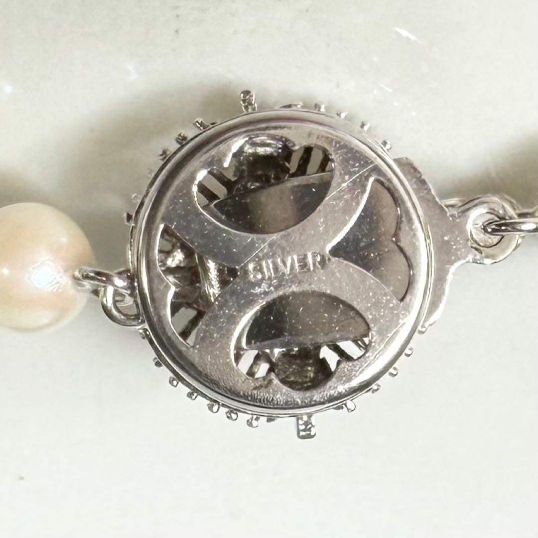 Okoya pearl necklace with pink pearls and silver clasp on white background