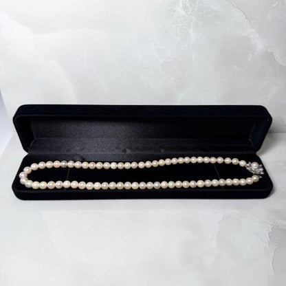 Okoya pearl necklace with pink pearls and silver clasp on white background