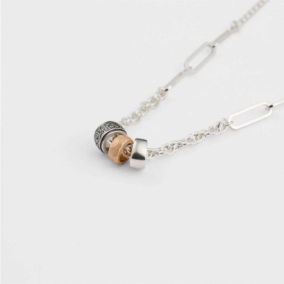 Agete 2025 Limited Edition Silver Necklace Set with three silver, gold, and black plated charms