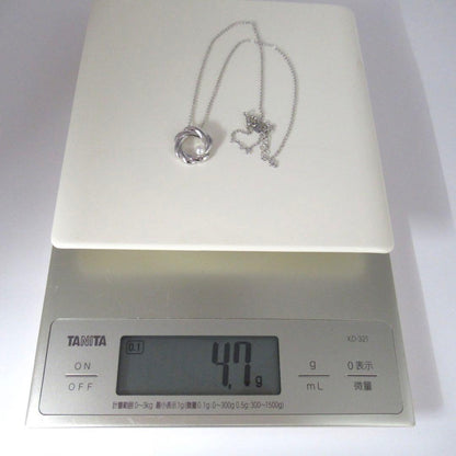 TASAKI Pearl Necklace Circle SUN featuring single pearl on 42 cm silver chain with pendant marked TASAKI