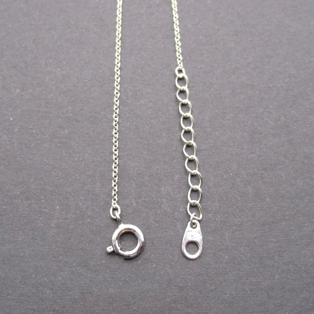 TASAKI Pearl Necklace Circle SUN featuring single pearl on 42 cm silver chain with pendant marked TASAKI