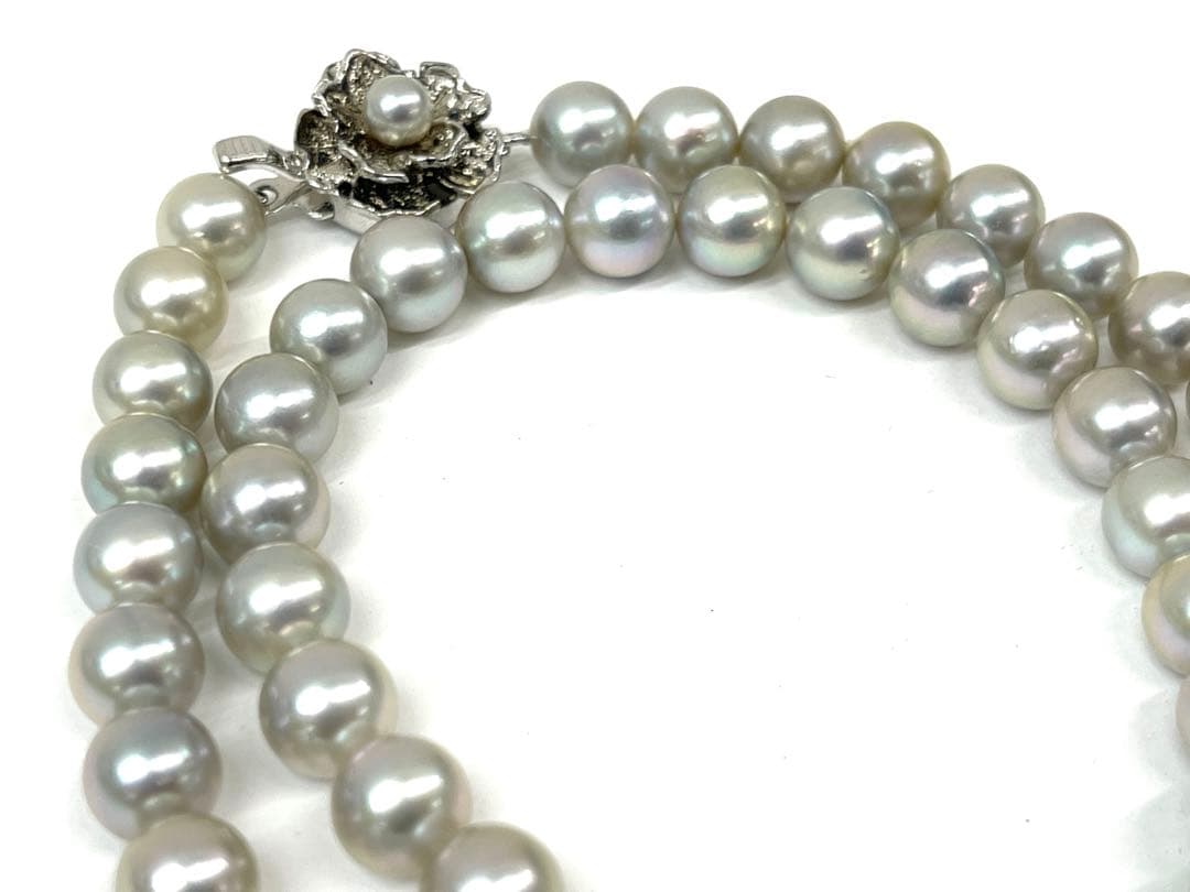 Camellia Akoya pearl necklace with 7.0-7.4mm pearls, single strand, and silver clasp on white background