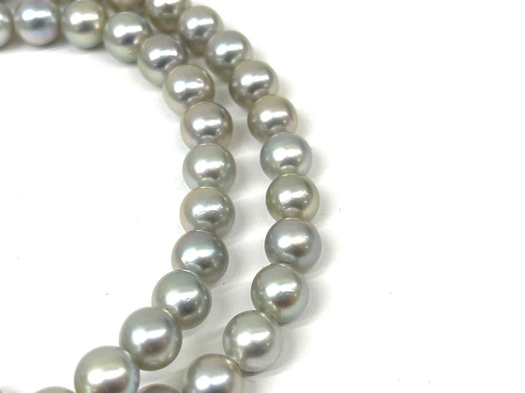 Camellia Akoya pearl necklace with 7.0-7.4mm pearls, single strand, and silver clasp on white background
