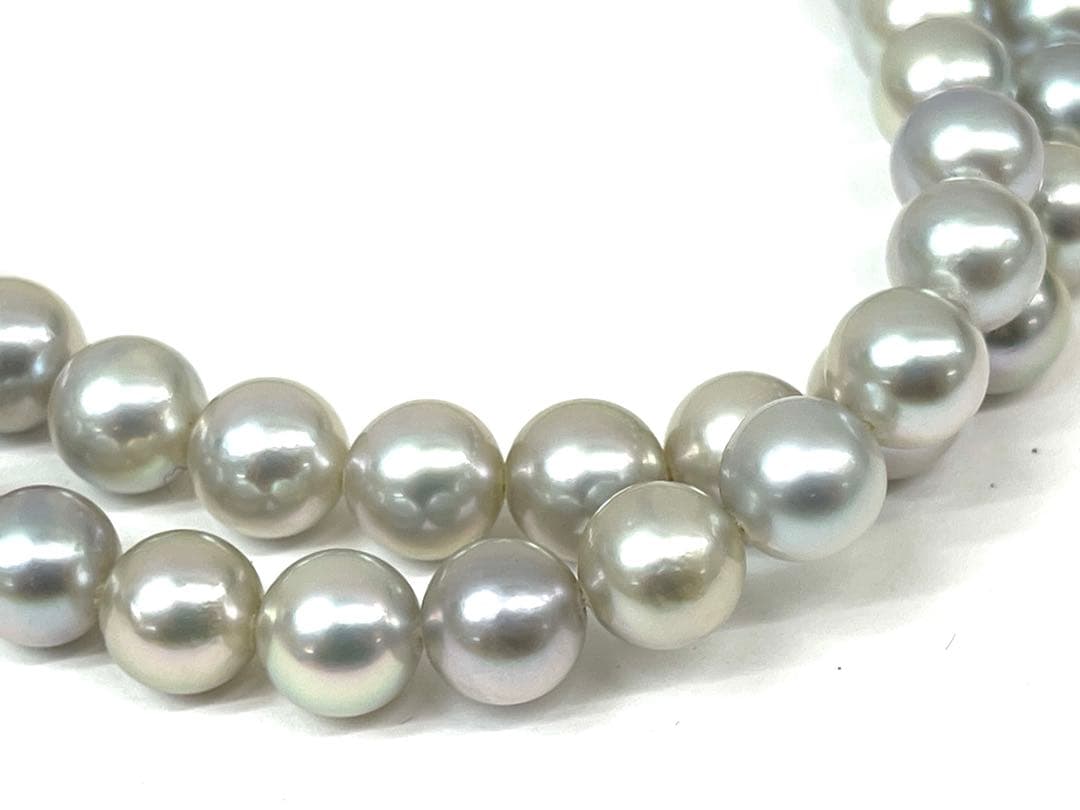 Camellia Akoya pearl necklace with 7.0-7.4mm pearls, single strand, and silver clasp on white background