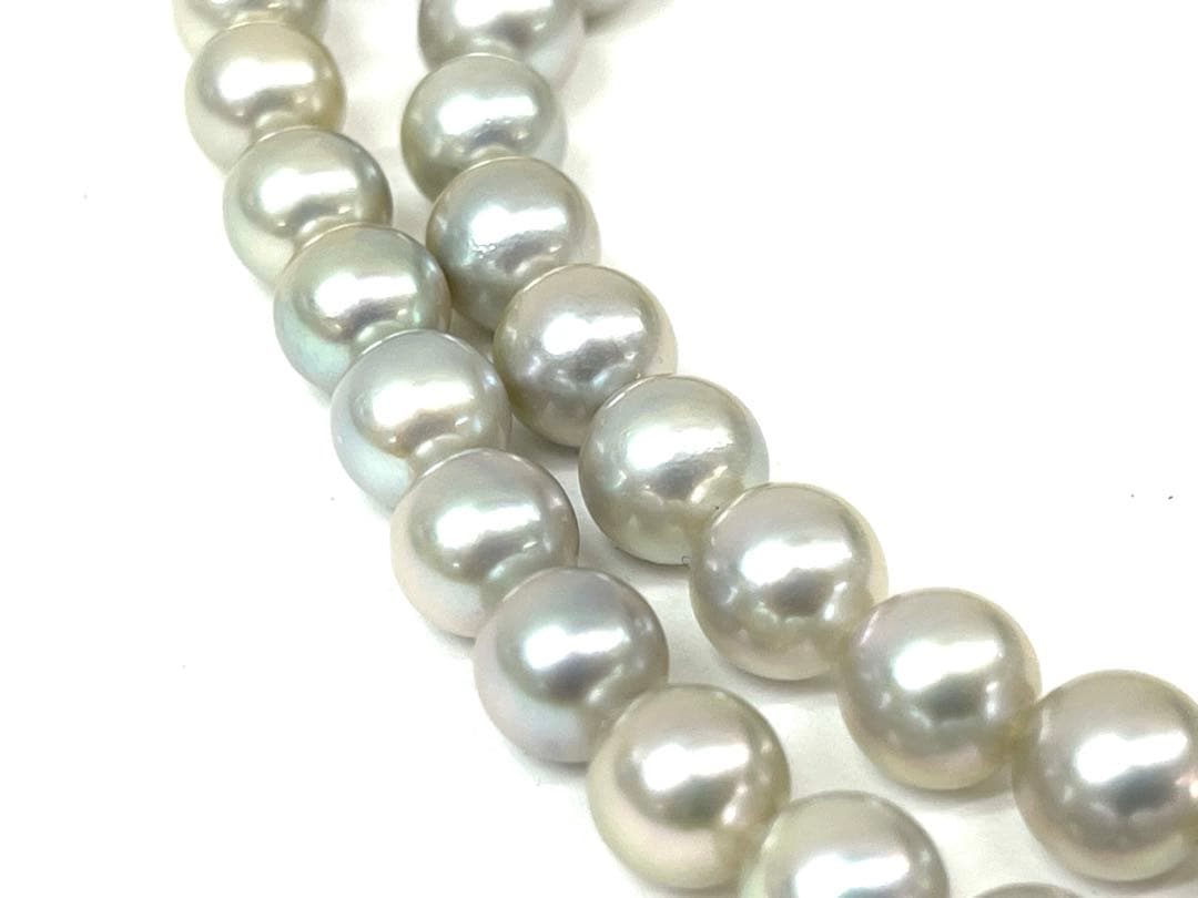 Camellia Akoya pearl necklace with 7.0-7.4mm pearls, single strand, and silver clasp on white background