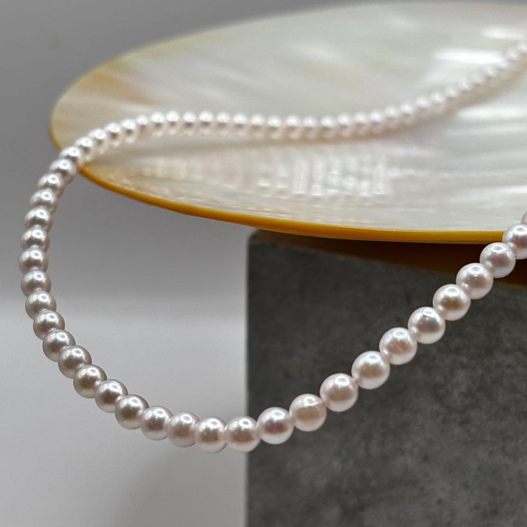 Akoya Pearl Pink Baby Pearl Necklace with white pink 3.5-4 mm pearls and 925 clasp on white background