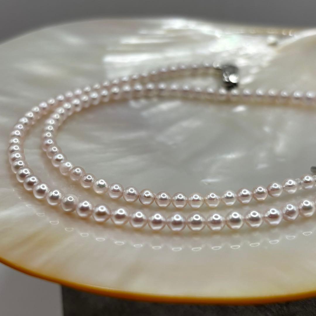 Akoya Pearl Pink Baby Pearl Necklace with white pink 3.5-4 mm pearls and 925 clasp on white background
