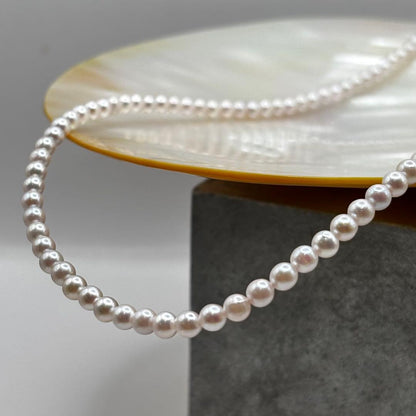 Akoya Pearl Pink Baby Pearl Necklace with white pink 3.5-4 mm pearls and 925 clasp on white background