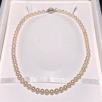 Akoya pearl semi-round pearl necklace with 6.4-7.0mm white pearls on silver chain, 42.8 cm length
