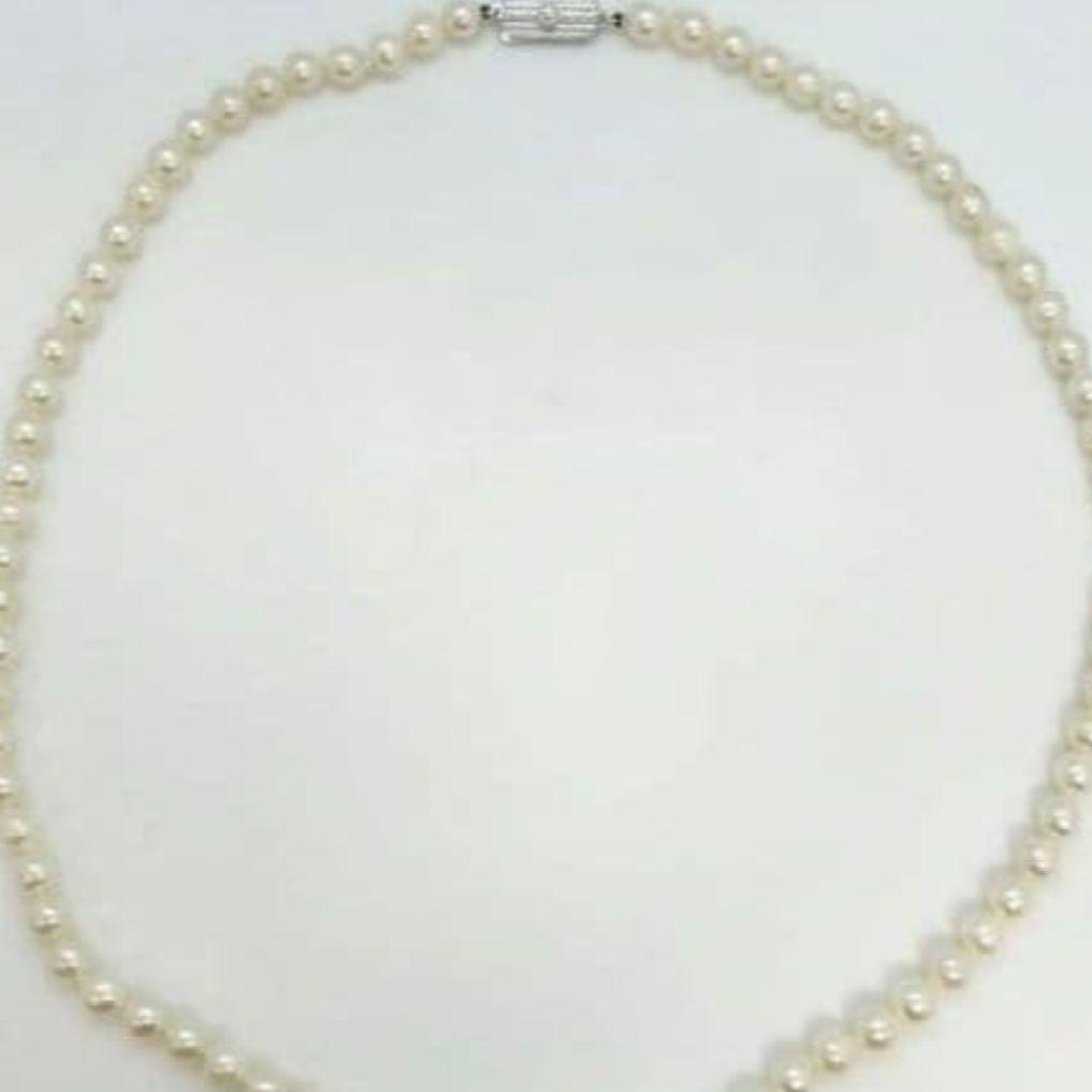 Mikimoto baroque pearl necklace with 6.6-6.8mm pearls and silver clasp, 54cm length, re-threaded in 2024