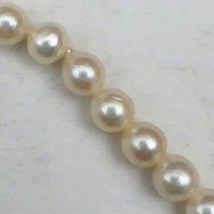Mikimoto baroque pearl necklace with 6.6-6.8mm pearls and silver clasp, 54cm length, re-threaded in 2024
