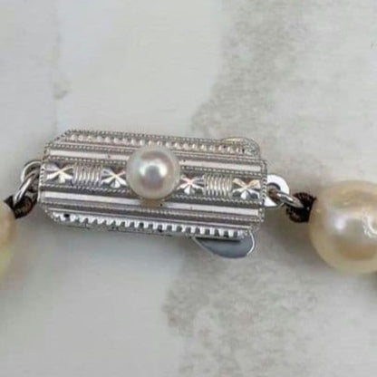 Mikimoto baroque pearl necklace with 6.6-6.8mm pearls and silver clasp, 54cm length, re-threaded in 2024